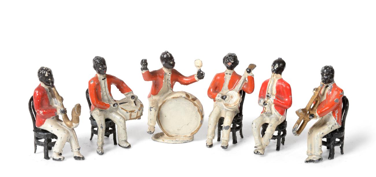 Lot 3542 - Taylor & Barrett Jazz Band with six seated figures: trombone, saxophone, clarinet, side drum, banjo