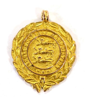 Lot 3030 - Jersey Football Association Medal, 9ct gold, one side worked with three lions enclosed by a...