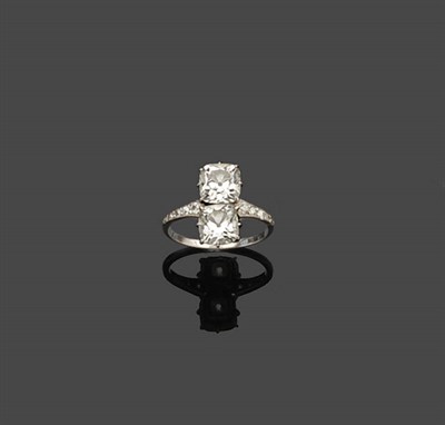 Lot 694 - A French Two Stone Diamond Ring, the cushion cut diamonds sit vertically in white claw settings, to