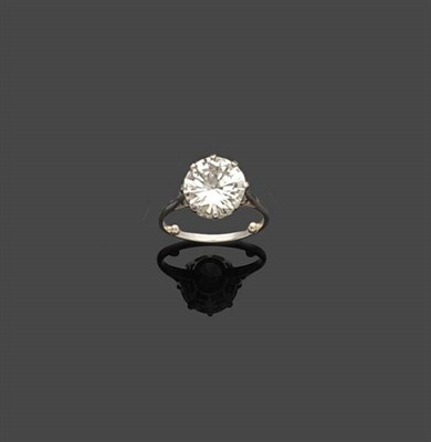 Lot 696 - A Diamond Solitaire Ring, the round brilliant cut diamond in a white eight claw setting, on a...