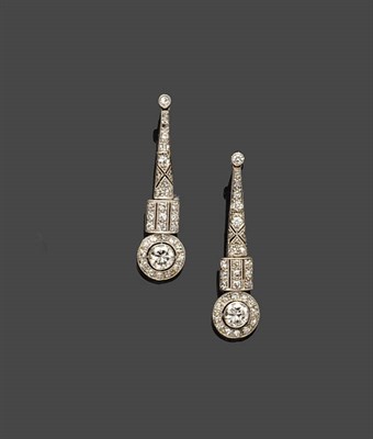 Lot 701 - A Pair of Diamond Drop Earrings, a tapered pierced column suspends three bars over a pierced...