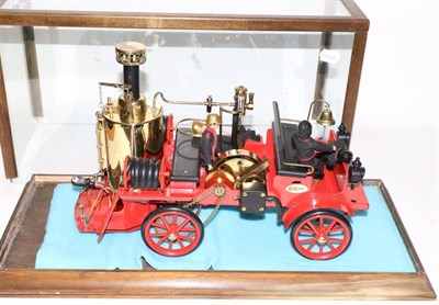 Lot 3298 - Wilesco Live Steam Fire Engine with four figures, in glass cabinet (E)