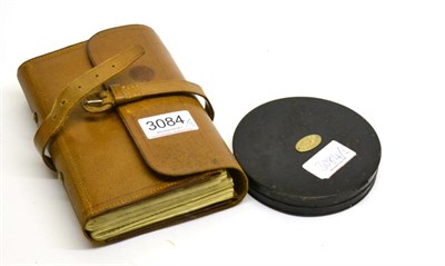 Lot 3084 - A Hardy Brothers Leather Fly Wallet, together with a Hardy cast tin (2)
