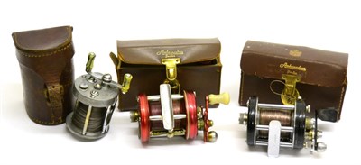 Lot 3130 - Two Abu Ambassadeur Multiplying Reels, comprising a 6000 in red and 6000C in black, in leather...
