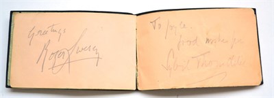 Lot 3140 - An Autograph Book, containing a few signatures, including Cary Grant, Maureen O'Hara, Myrna...