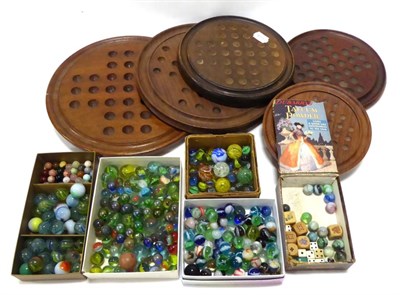 Lot 3153 - Solitaire Boards a collection of five wooden examples together with a quantity of marbles
