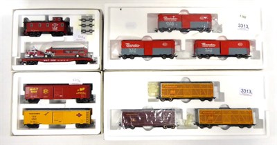 Lot 3313 - Marklin HO US Wagon Sets 45690 Union Pacific Livestock Dispatch, 45648 NYC Pacemaker boxcars,...