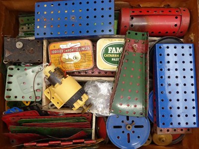 Lot 3387 - Meccano A Collection Of Loose Parts including pre-war red/green, a few leaflets and other items...