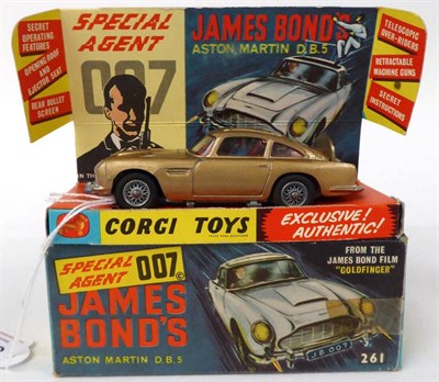 Lot 3445 - Corgi 261 James Bond Aston Martin DB5 gold in display box (E box G-E, with instructions)