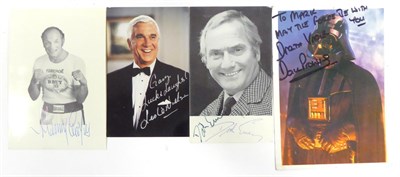 Lot 128 - Four Signed Publicity Photographs Dick Emery, Henry Cooper, Leslie Nielson and David Prowse...