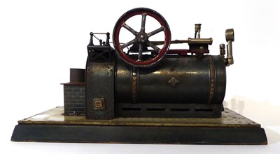 Lot 316 - Bing Live Steam Stationary Engine with horizontal boiler mounted on brick effect embossed tin base