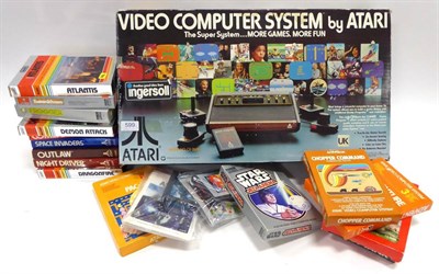 Lot 599 - Atari Video Computer System CX-2000 together with a box of game cartridges including Pacman,...