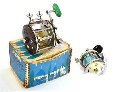 Lot 131 - Penn Peer No.309 Multiplier Sea Fishing Reel in original box, together with a Mitchell 622 reel (2)