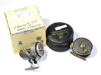 Lot 143 - Two Alloy Hardy Reels, comprising a 3 1/4inch 'Silex Major', with white handles, brass foot, in zip