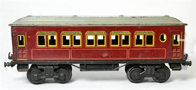 Lot 292 - Bing Gauge 1 Passenger Coach burgundy with yellow lining and grey clerestory roof 12.5";, 31cm...