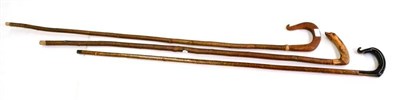 Lot 118 - Three Shepherds Crooks, one with handle modelled as a dog