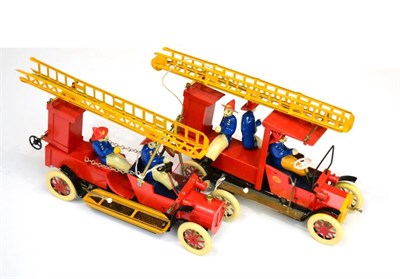 Lot 296 - Tucher & Walther T182 Fire Engine with two figures, raising ladder and bell, in original box...