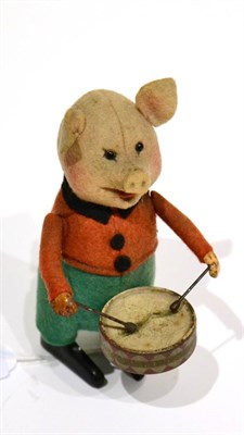 Lot 305 - Schuco (Germany) Clockwork Pig Drummer red/green clothing (generally G-F, spring broken)