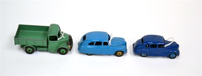 Lot 357 - Dinky Standard Vanguard (E-G) Austin Devon (G, some damage from damp) and Bedford open wagon...