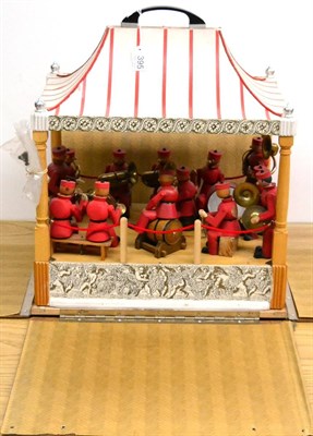 Lot 395 - Mechanical Brass Band Stand with 13 articulated wooden figures playing various instruments, the...