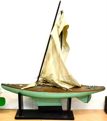 Lot 62 - Wooden Pond Yacht with single mast, twin sails, green painted hull and plank effect decking...