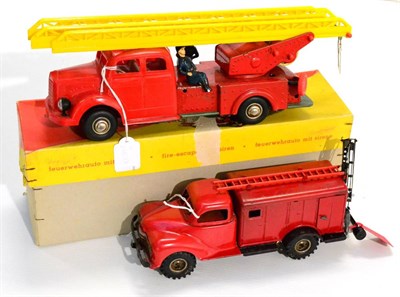 Lot 217 - Gunthermann 872 Friction Fire Engine with siren, with plastic cab and two part ladder and two...