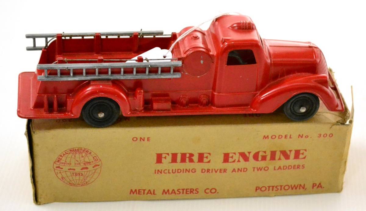 Lot 231 - Metal Masters Diecast Fire Engine including driver and two ladders in original box 10";, 27cm...