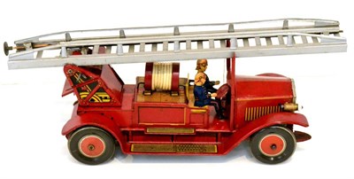 Lot 246 - TippCo C/w Fire Engine with two figures and two piece ladder; fitted with electric headlamps...