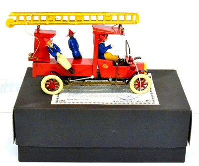 Lot 251 - Tucher & Walther Fire Engine with three figures, raising ladder and roof over cab, in original...