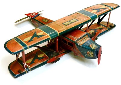 Lot 288 - Made In Germany Large Trimotor Biplane lithographed in red/blue/cream, with detachable wings...