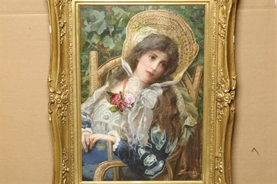 Lot 1018 - Isaac Snowman (1874-1950) Israeli Portrait of a Girl, seated in a garden, wearing a blue...