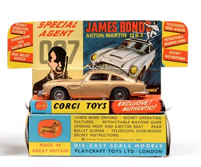 Lot 428 - Corgi 261 James Bond Aston Martin DB5 in display box with leaflet, two men and lapel badge (E-G box