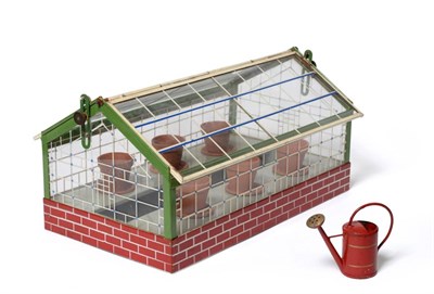 Lot 211 - Hausser Greenhouse an unusual toy of tin construction with glass windows and roof (both roof panels