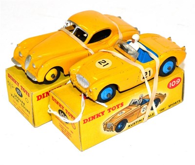 Lot 264 - Dinky 157 Jaguar XK120 yellow (E-G but has had silver painted on windscreen frame, box G-E) 109...