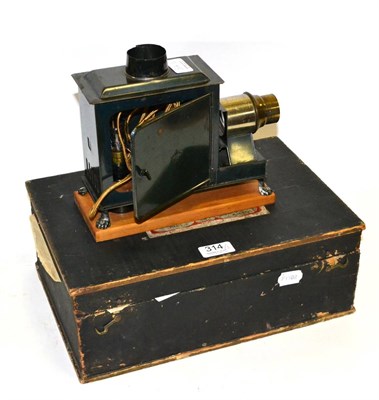 Lot 314 - Bing Magic Lantern fitted with electric lamp, marked with GBN diamond, four small boxes of...