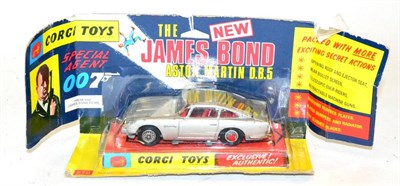 Lot 315 - Corgi Two James Bond Aston Martin DB5s (i) 270 Silver with rotating numberplate, and tyre...