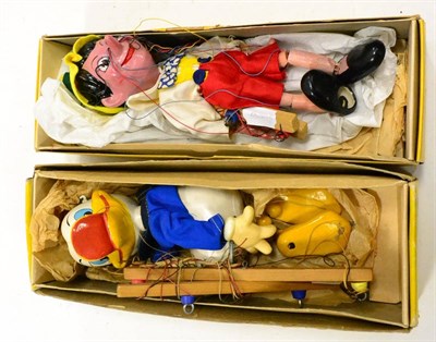 Lot 408 - Pelham Puppets SL Pinocchio and Sl Donald Duck (both E-G boxes G) (2)