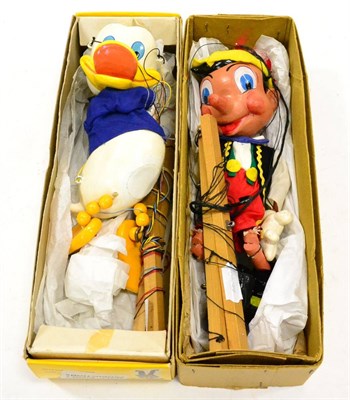 Lot 409 - Pelham Puppets SL Pinocchio large head in plain card box and Sl Donald Duck (both E-G boxes G) (2)