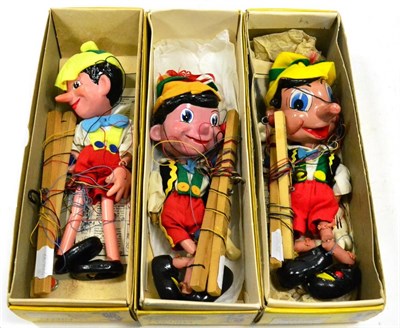 Lot 418 - Pelham Three Pinocchios (i) Large head in box with ";Walt Disney Productions sticker (ii)...