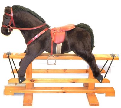 Lot 1012 - Pegasus Of Crewe Rocking Horse plush covered with leather padded saddle, on wooden rocker 47";,...