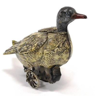 Lot 1180 - German (?) An Early Clockwork Duck with flapping wings, hand painted in cream with head...