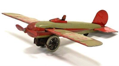 Lot 1185 - Wells c/w Monoplane lithographed in grey/red with pilot figure and registration G-E OBT 11";,...