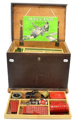 Lot 1186 - Meccano A Collection Of Loose Post-War Red/Green Parts contained in  wooden chest with internal...