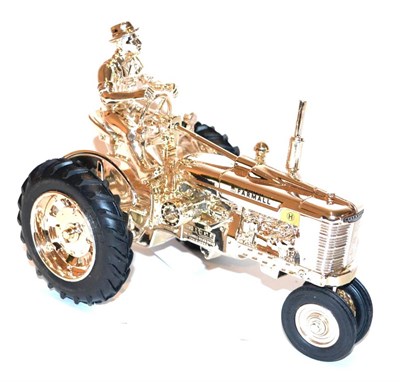 Lot 1252 - Ertl 50th Anniversary Farmall H Tractor With Farmer No.1 Of 1100 Produced in gold finish (E-G, some