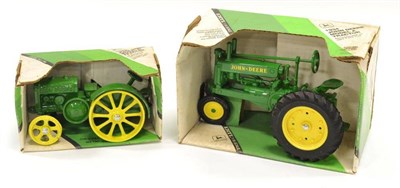 Lot 1253 - Ertl Two John Deere Tractors 1934 Model A and 1929 Model D, both green (both E boxes G-F) (2)