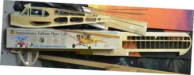 Lot 55 - Part Constructed Model Flying Aircraft Of A Piper Cub in balsa wood with a large number of parts to