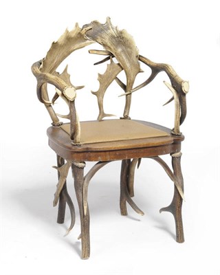 Lot 1159 - An Austro-German Antler Armchair, circa 1885, composed of red and fallow deer antlers, with (later)