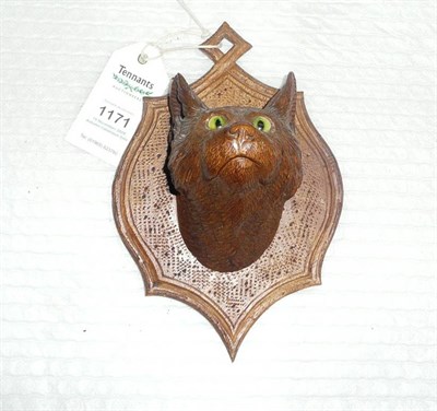 Lot 1171 - A Brienz (Switzerland) Carved and Stained Lindenwood Head of a Cat, circa 1895, with green...