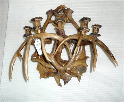 Lot 1174 - A German Antler Five Light Wall Appliqué, late 19th century, applied with a metal plaque...