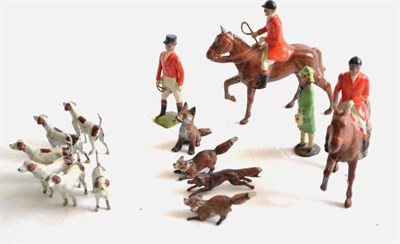 Lot 304 - Britains Hunting Figures two mounted with whips, standing with whip (all in Pinks) six hounds and a